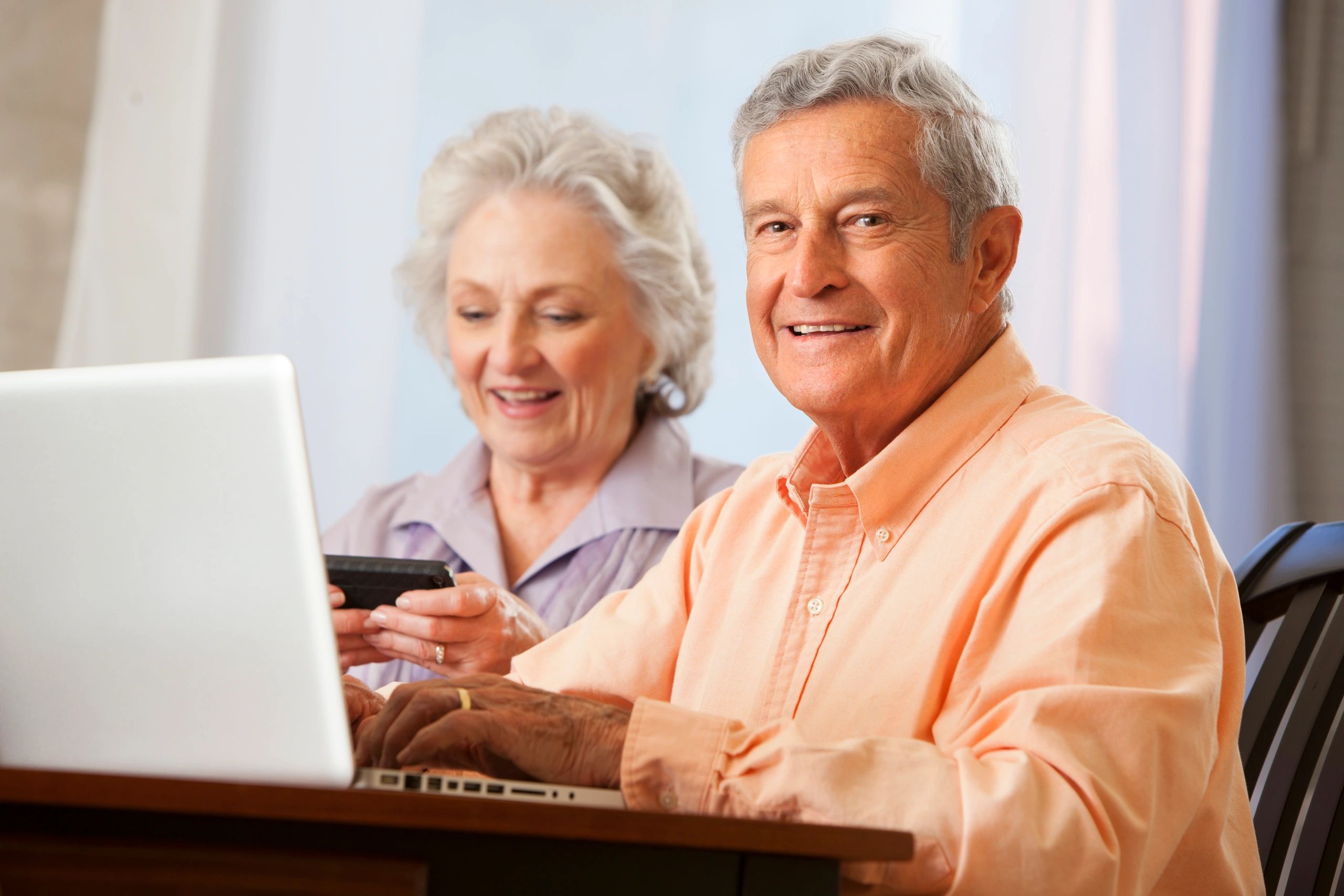 happy seniors using technology